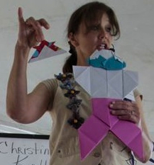Christine Petrell Kallevig telling her origami man story